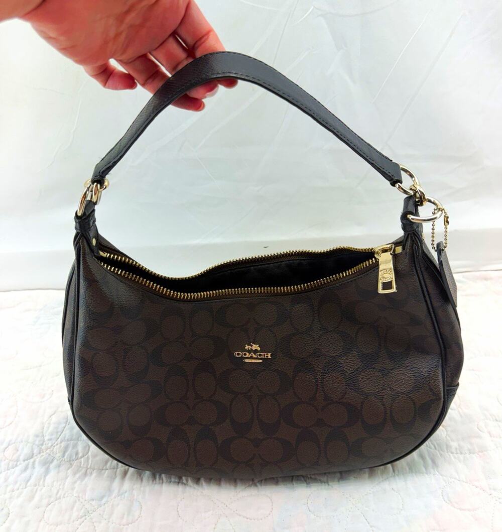 Coach Signature brown black zip top shoulder bag crescent charm gold feminine